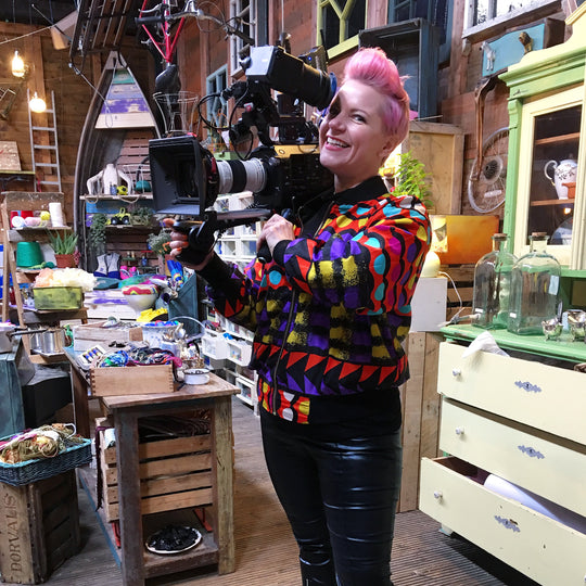 Zoe Pocock on the set of Junk Rescue holding the camera