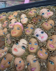 Muck N Brass Posters, Prints, & Visual Artwork Toys R Art Doll Faces in a navy frame