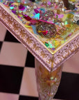 Medium encapsulated jewellery resin table.